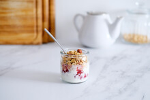 Oatmeal Granola With Greek Yogurt And Nuts Strawberry Muesli In Jars On Light Background