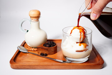 Affogato Coffee Espresso in a glass jar with vanilla ice cream close-up (spot focus)