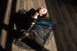 © ADDICTIVE STOCK - Ballerina laying down dance studio floor