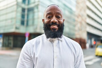 Poster - Young african american man smiling confident standing at street