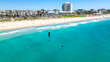 Areal photo of kite surfer on the turquoise water in front of the popular Scarborough Beach in Western Australia.