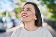 © Krakenimages.com - Middle age woman smiling confident looking to the sky at park