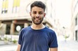 © Krakenimages.com - Young arab man smiling confident on a sunny day at the street