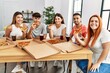 © Krakenimages.com - Group of young people smiling happy eating italian pizza sitting on the table at home