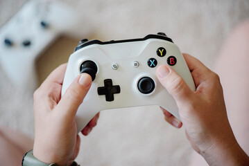 Close up of woman holding joystick 