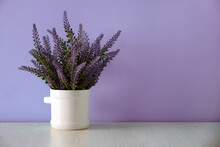 Lavender Artificial Flowers Isolated On Lilac Background. Copy Space