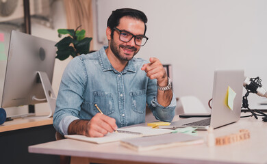 Wall Mural - entrepreneurial executives sitting smiling. business manager lifestyle Indoor self-confidence.professional male technical young white computer company work laptop