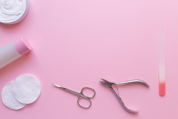 Wall Mural - Set of manicure and pedicure tools on pink background