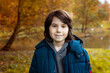 © Anna - Close up portrait of a young teenager boy , smiling child outdoor in autumn in the park.