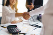 © PaeGAG - Business people shaking hands, finishing up meeting. business hand shake concept.