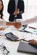 © PaeGAG - Business people shaking hands, finishing up meeting. business hand shake concept.