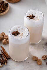 Iced chai latte with warm winter spices topped with milk foam