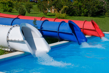 Wall Mural - Colorful slides in the water park in summer