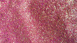 Fondo de brillos / glitter de color rojo, fucsia, rosa, dorado. Se puede usar como fondo	