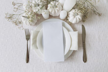 Thanksgiving Table Setting, Tableware And Decorations. Blank White Postcard On Table Mockup, Top View