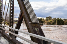 Metal Beam Of Bridge With Flooding Hunter River Rising Up Close