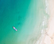 Top view of Speed Boat for tourist surrounding by blue aqua sea water and white sand beach. Capture by drone.	