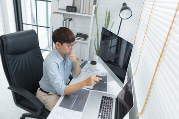 Wall Mural - software development concept, male programmer pointing on laptop screen to checking data codes