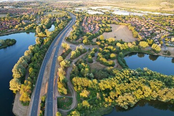 Aerial View of Caldecotte Lake at Sunset, A beautiful lake split across 2 sides, drone's high angle footage of People and Landscape of England UK