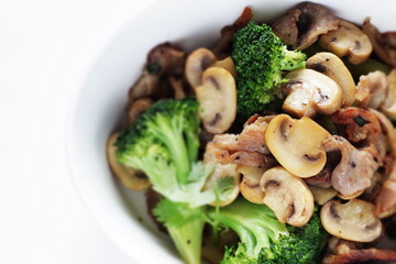 Chinese food, sliced mushroom and broccoli stir fried with pork