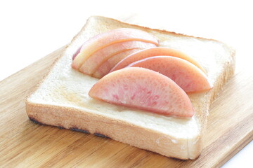 Japanese peach on toast with copy space for summer gourmet cooking