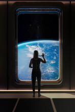 Female Astronaut Saying Goodbye To Earth