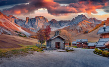 Extraordinary Autumn Sunset In Fuchiade Valley. Amazing Evening View Of Dolomite Alps, Italy, Europe. Spectacular Outdoor Scene Of Italy, Europe. Beauty Of Countryside Concept Background.
