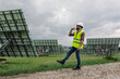 © ADDICTIVE STOCK - Male engineer walking on solar power plant