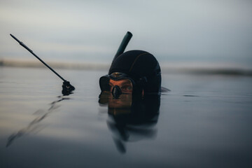 Wall Mural - Spearfishing diver hunting in the middle of the sea