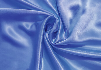 Smooth elegant blue silk or satin luxury cloth texture can use as abstract background. Luxurious blue background design