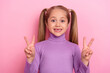Portrait of adorable sweet little female showing v sign meet friend say hello isolated on pink color background