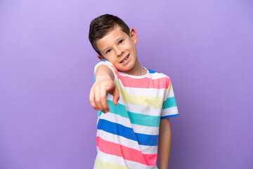 Wall Mural - Little boy isolated on purple background pointing front with happy expression