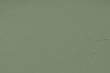 Saturated Pastel Gray Green Colored Low Contrast Concrete Textured Background. Empty Colourful Wall Texture With Copy Space For Text Overlay And Mockups. 2023, 2024 Color Trend