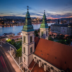 Wall Mural - Budapest, Hungary - Aerial panoramic view of illuminated Budapest Inner-City Mother Church of Our Lady of the Assumption and Elisabeth Bridge at dusk with Buda Castle Royal Palace at background