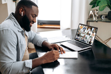 Sticker - Group video meeting with multiracial people. Friendly african american man, sit at a desk in, having video meeting with colleagues, conducts financial brainstorm with business partners, takes notes