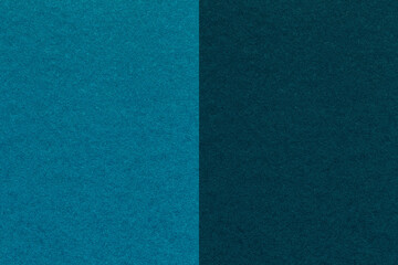 Texture of craft navy blue and turquoise paper background, half two colors, macro. Vintage dark cerulean cardboard.