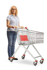 Poster - Mature woman standing with an empty shopping cart