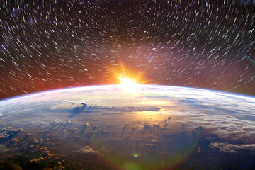 Wall Mural - landscape image of earth, sunrise and star trail view from space. (elements of this image furnished 
