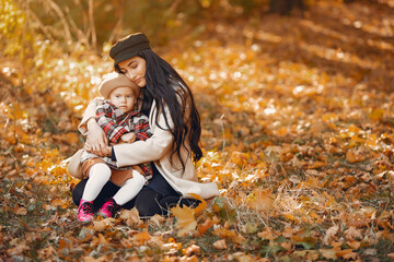 Wall Mural - Cute and stylish family in a autumn park