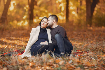 Wall Mural - Beautiful couple spend time in a autumn park