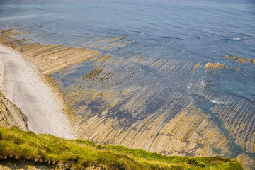 Wall Mural - the coast of zumaia with the geologically unique flysch stratification