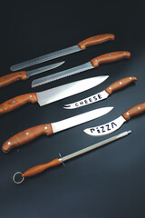 Wall Mural - Set of Kitchen knives on grey background. Quality Kitchen Knives