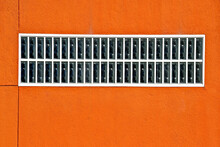 Clear Block Security Window On Orange Wall