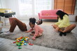© FotoArtist - Joyful multiethnic family and their leisure at home