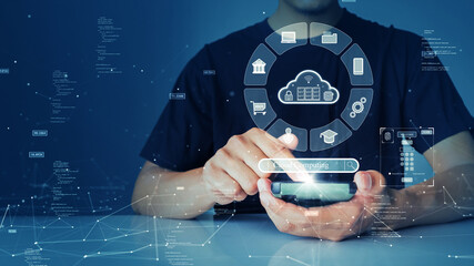 Leinwandbilder - A person is connecting to the Internet through a smartphone to access cloud computing technology that has cybersecurity protection to protect user data. small binary code polygon on blue background.