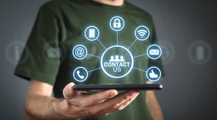 Wall Mural - contact us concept with a man holding smartphone. customer support