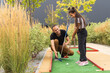 © Angelov - father and daughter playing mini golf