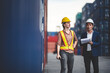 © chokniti - businessman person or engineer and foreman wearing safety helmet are talking about business manager job for logistic shipping transportation at cargo container yard, warehouse control industry work