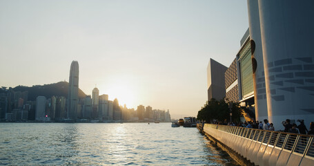 Poster - People walk at the water promenade in the evening