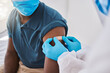 © Kirsten Davis/peopleimages.com - Hospital nurse, covid vaccine flu shot and patient with mask, bandage plaster arm, medical doctor or healthcare professional worker. Coronavirus epidemic and disease control by medical expert.